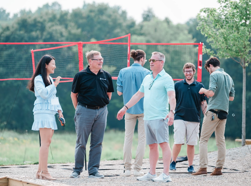 Group of people in casual clothing enjoying outdoor retreat activities at Retreat 21 near Columbus, Ohio